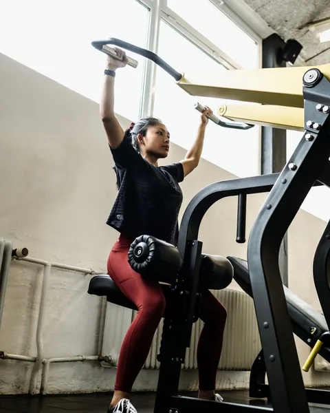 Woman strength training in a gym